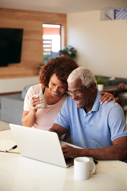 senior african american couple using laptop